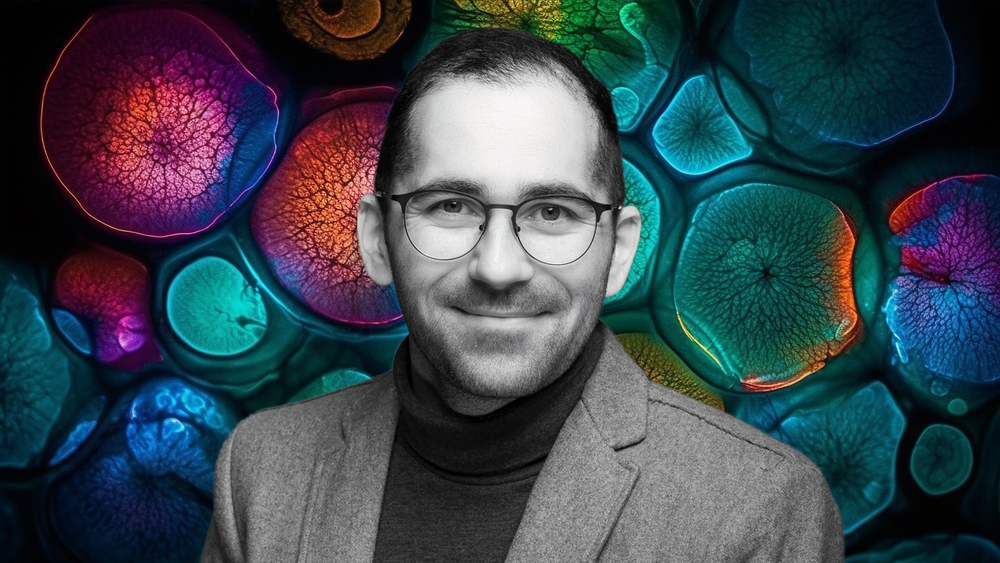Dr Damian Jacenik on the background of a collage of colorful cells