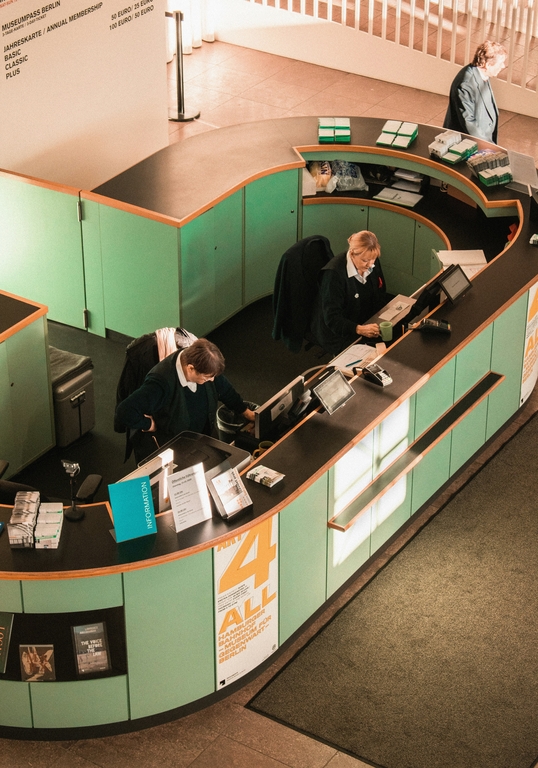 A decorative element: Two women at the hotel reception