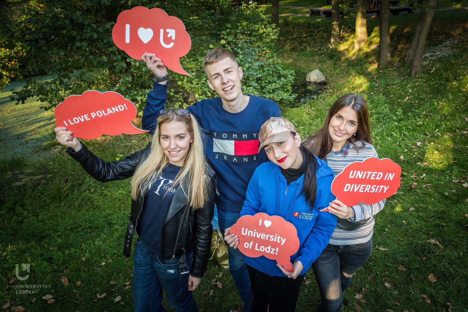 International University of Lodz students smile directly at the camera.