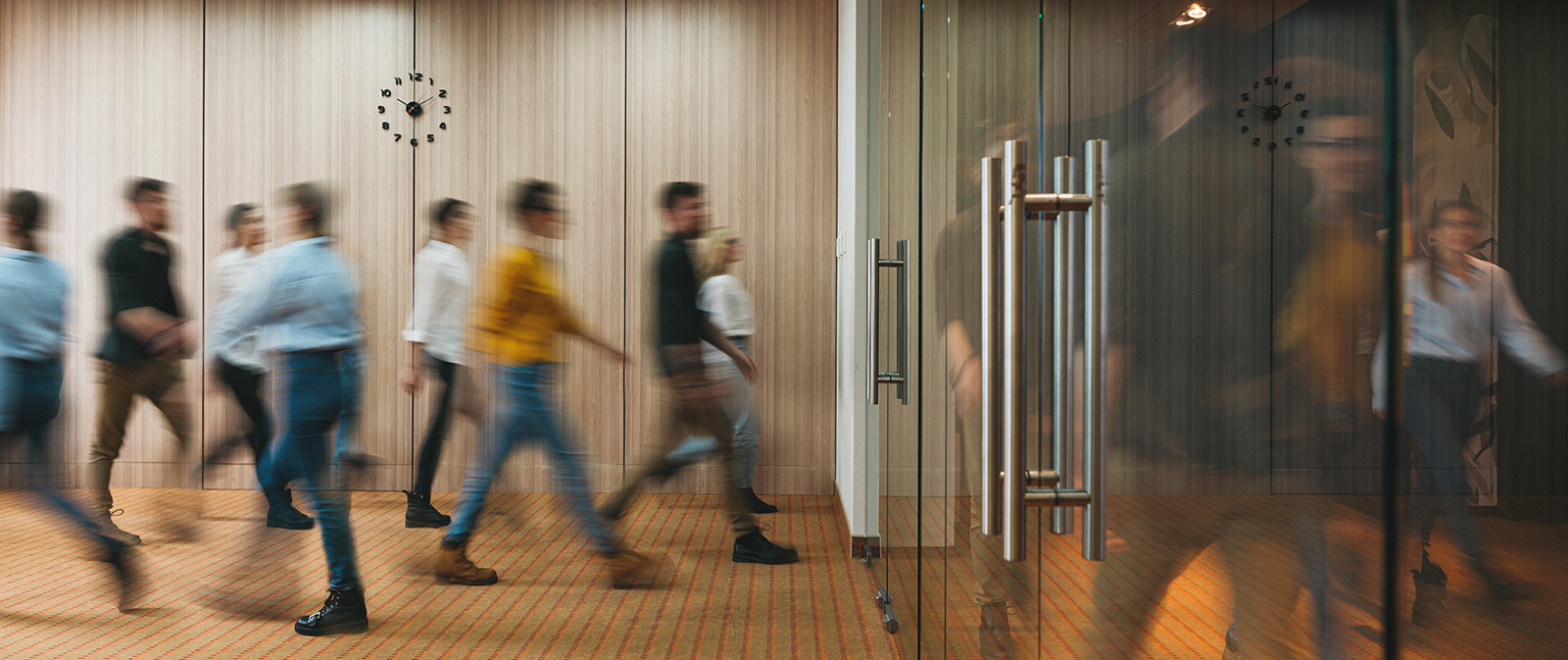 a decorative element: people walking in the office
