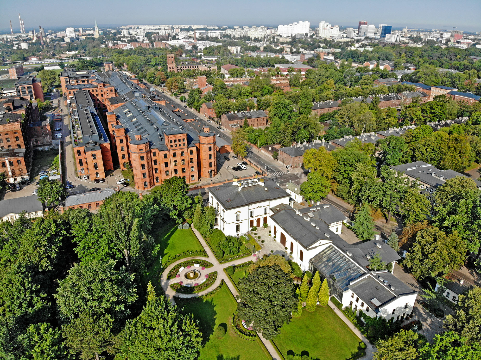Lodz from a bird's eye view, with Herbst Palace and green areas in the frame