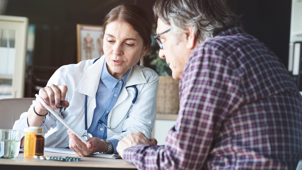 A decorative element: A doctor analysing patient's results on tablet