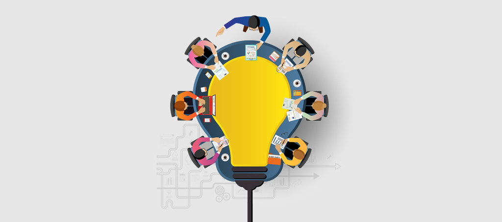 grafika IPMA XV, ludzie siedzący przy stole w kształcie żarówki