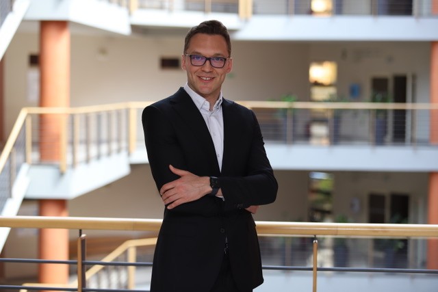 a portrait photo of Dr Dominik Skowroński