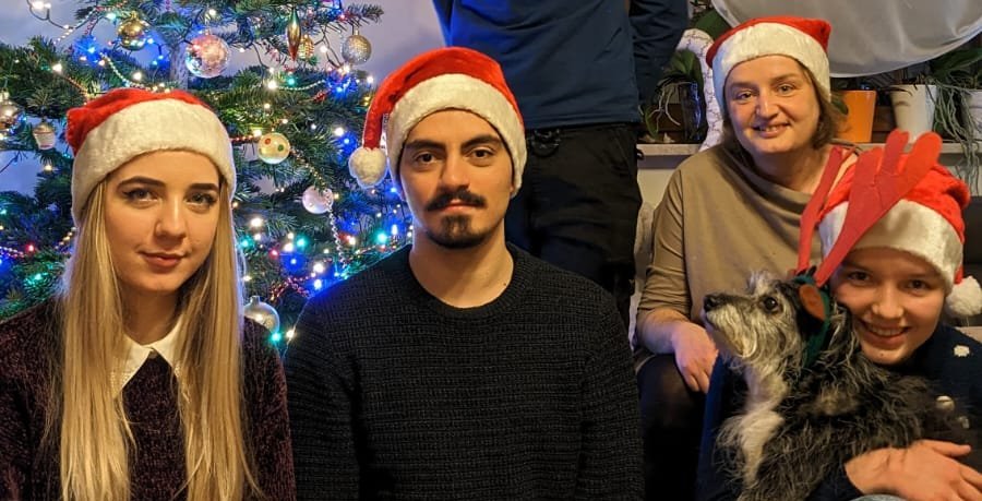 Participants of the University of Lodz "Christmas Guest" campaign wearing Santa's hats