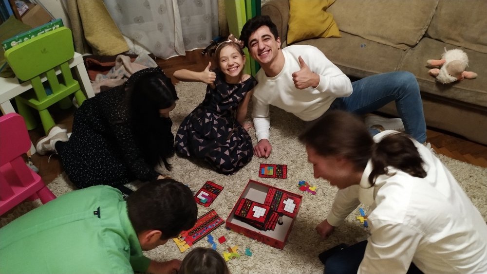children and international guests playing together