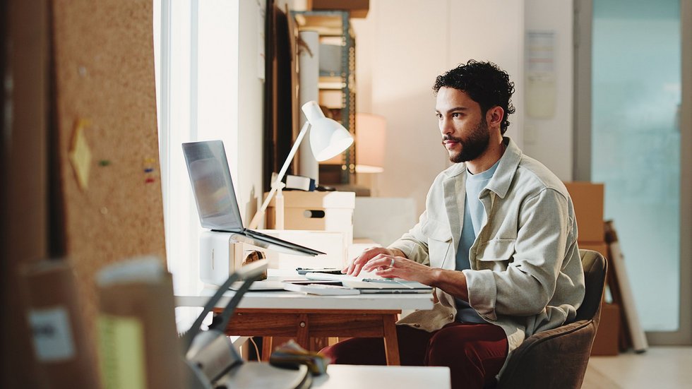 a decorative element:a man at a laptop