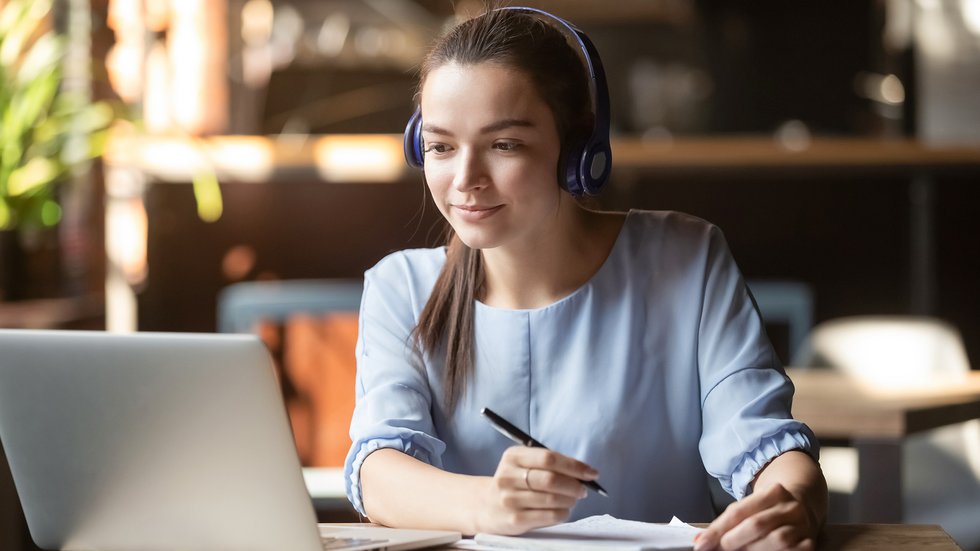 AA decorative element: a young woman at a laptop