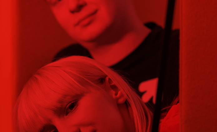 a male and a female students in a library