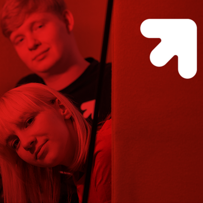 Two students, a boy and a girl, on a red background 