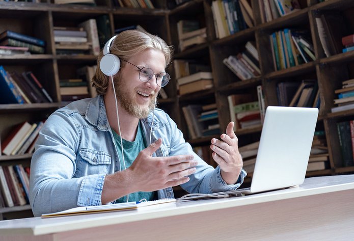 A man in front of a computer screen