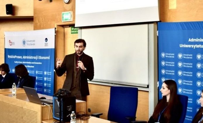 The student delivering his speech at the conference