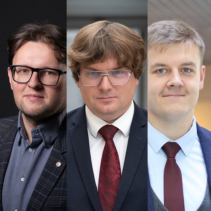 Trzech mężczyzn w garniturach.