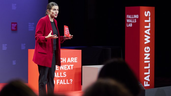 a woman delivering a speech during the competition