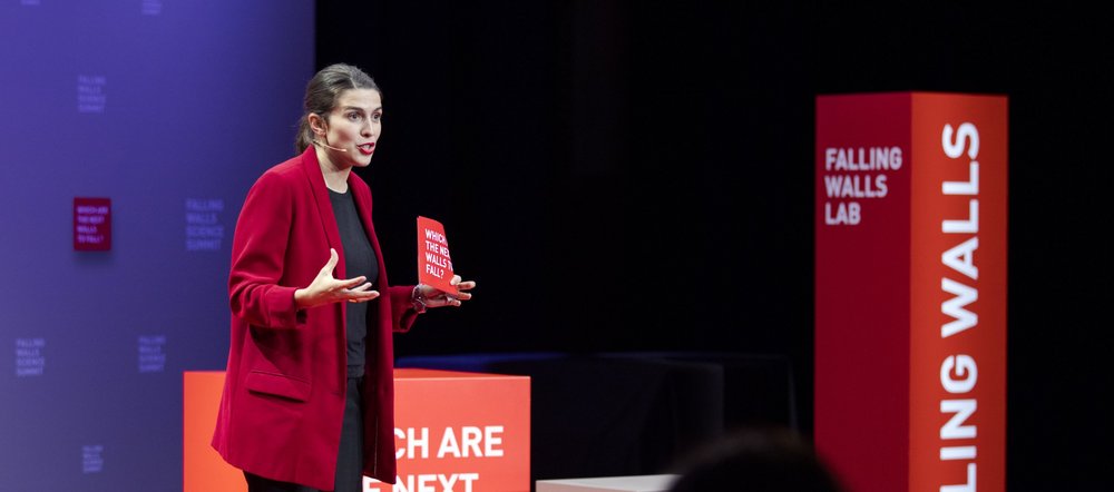 a woman delivering a speech during the competition