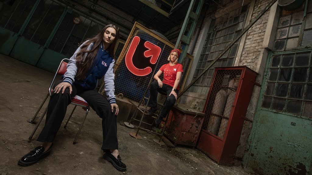 Two young girls in an old factory