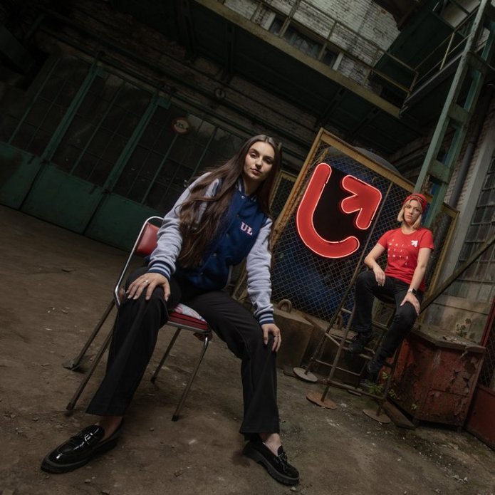 Two young girls in an old factory