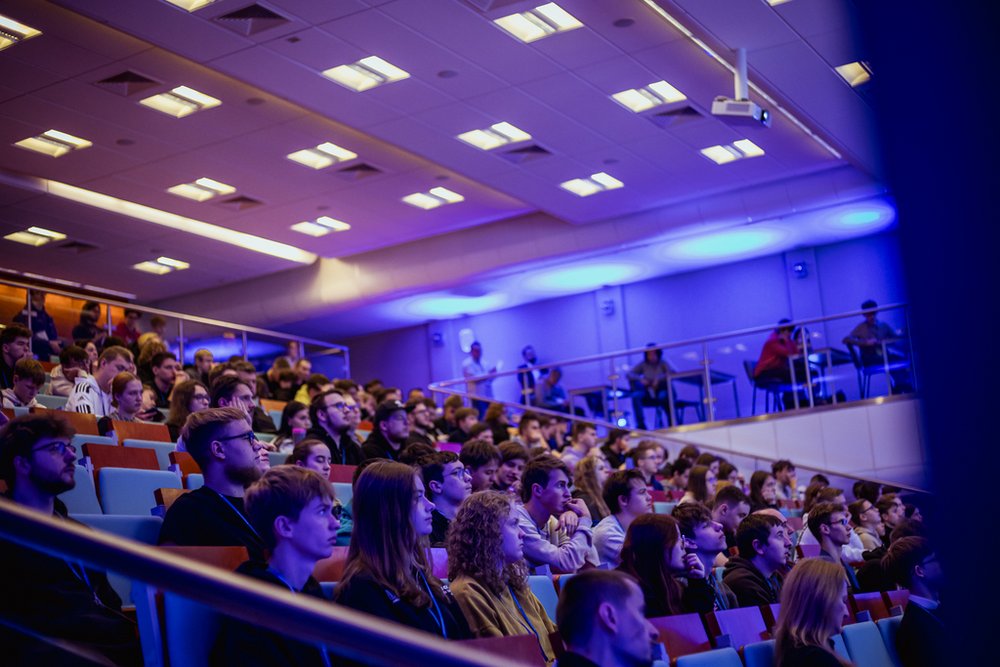 the event participants sitting and listening to the lecture in the assembly hall