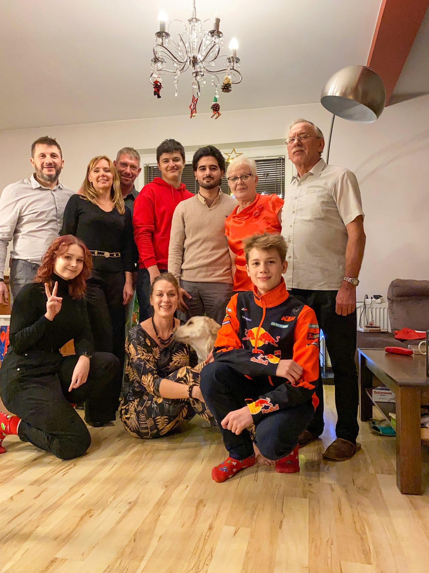 Participants of the University of Lodz "Christmas Guest" campaign, group of people smiling when posing for a photo