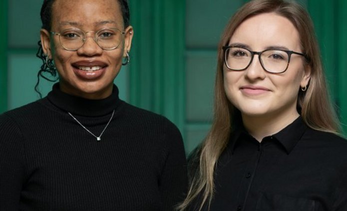 The two UNIC Ambassadors dressed in black standing next to each other