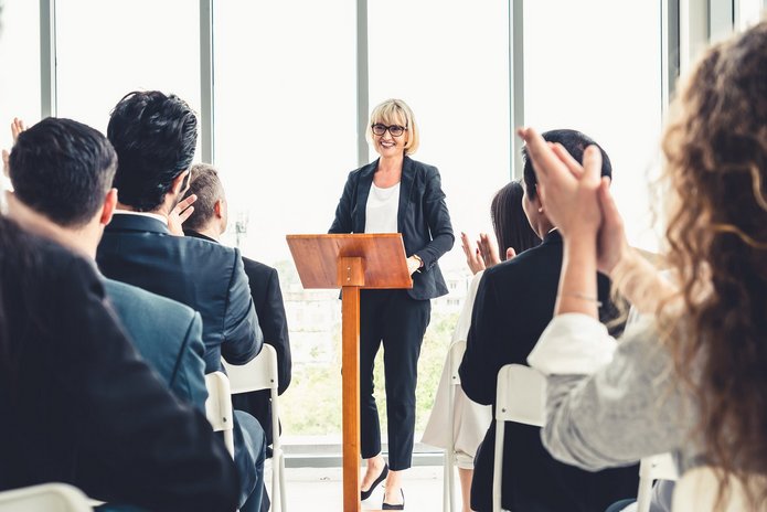 a decorative element: a group of people during a meeting