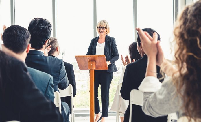 a decorative element: a group of people during a meeting