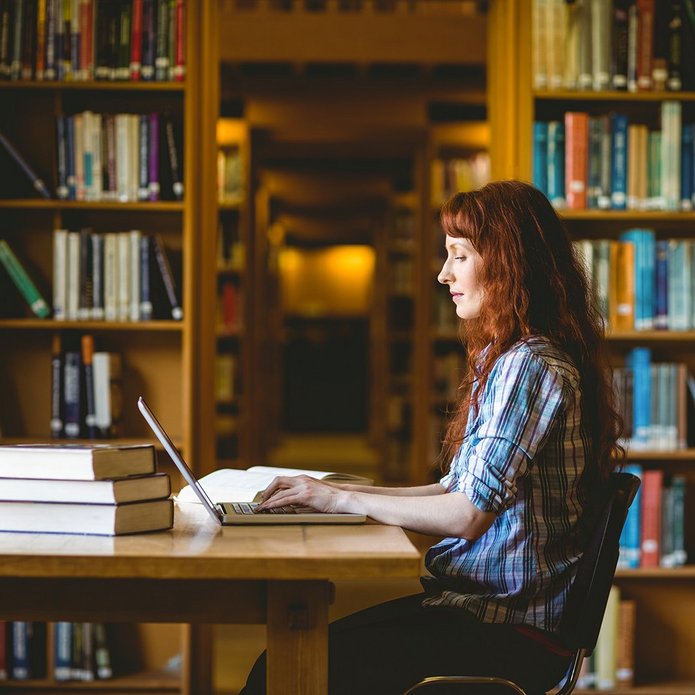 a decorative element: a woman sitting in front of a laptop