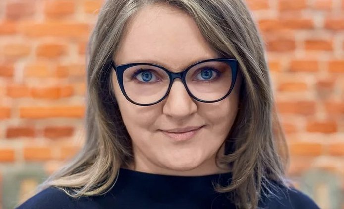 a portrait photo of Dr Małgorzata Grodzicka-Kowalczy