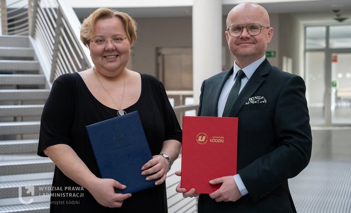 A woman in an elegant dress and a man in a suit