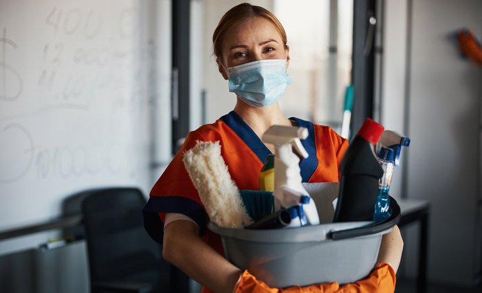 Cleaning lady in a mask