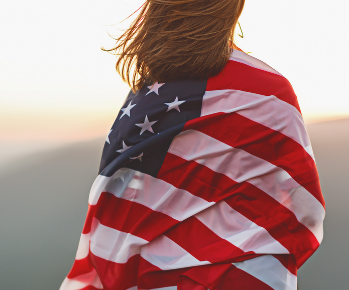 a woman with a flag of the United States
