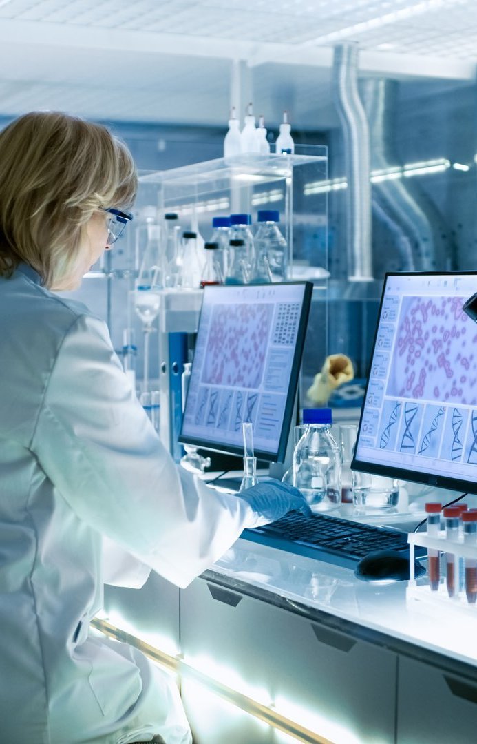 female and male scientists working on computer