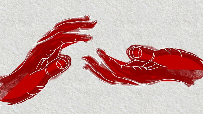Dwie dłonie wykonujące gest wsparcia