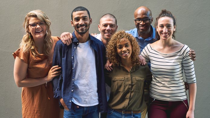 Friends all grouped together. Shot of a group cheerful friends standing together for a portrait while looking at the camera. element dekoracyjny