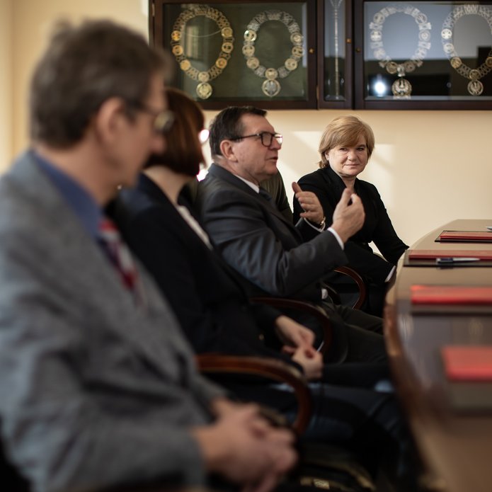 four people discussing at a table