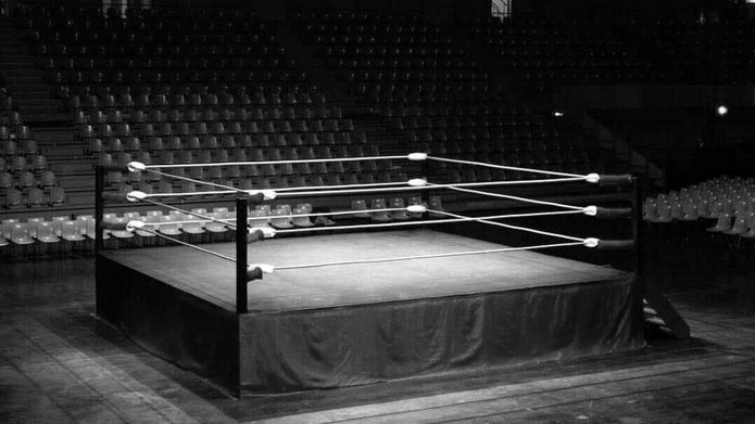 a black and white photo of the boxing ring