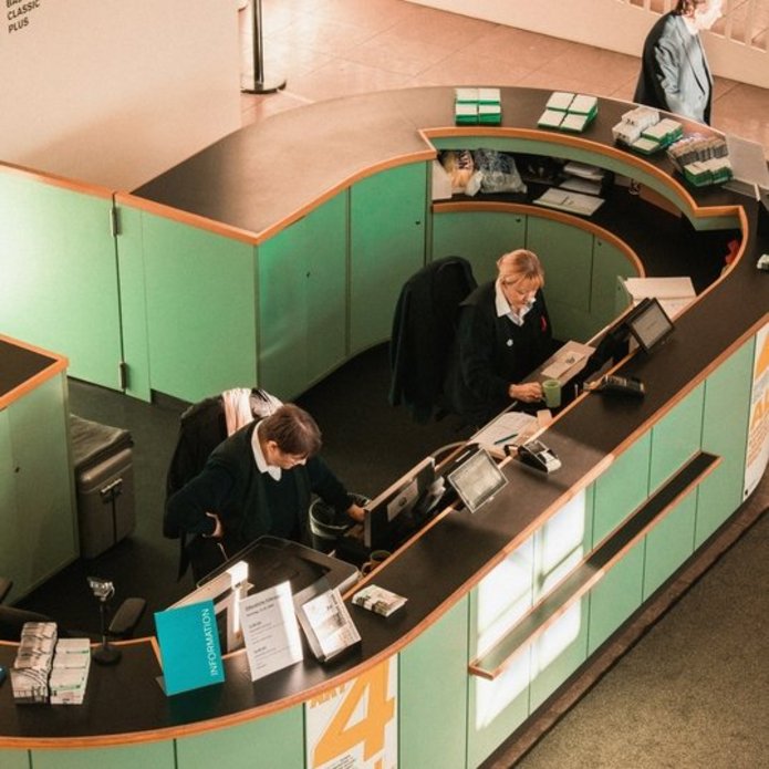 A decorative element: Two women at the hotel reception