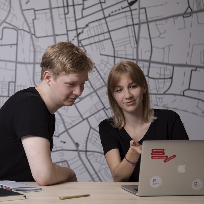 Two University of Lodz students sitting at a computer