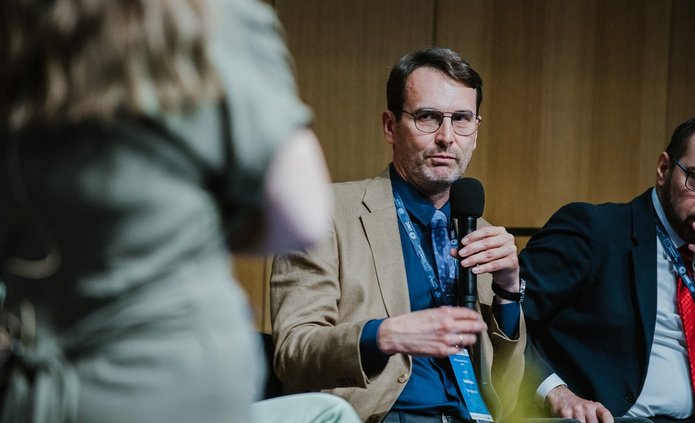 Prof. Rafał Matera with a microphone