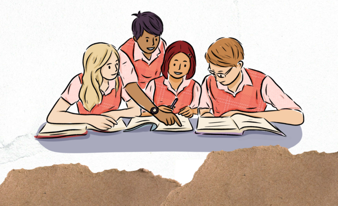 Studenci pochyleni nad książkami