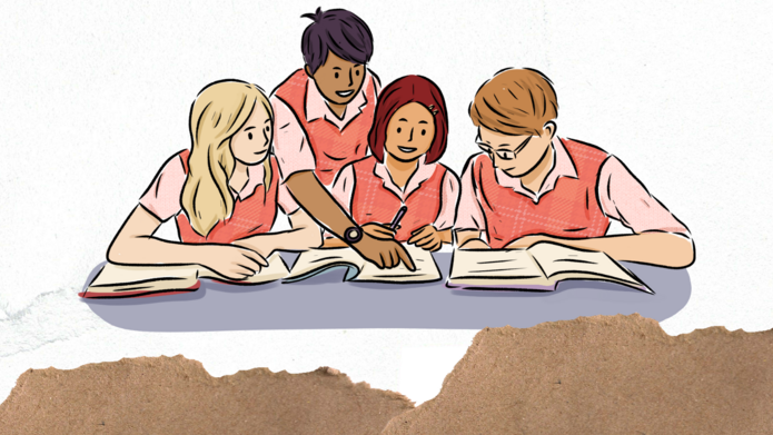 Studenci pochyleni nad książkami