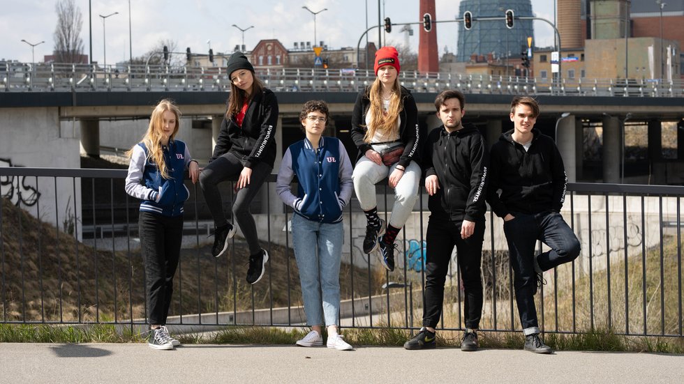 Students of the University of Lodz on the background of the city