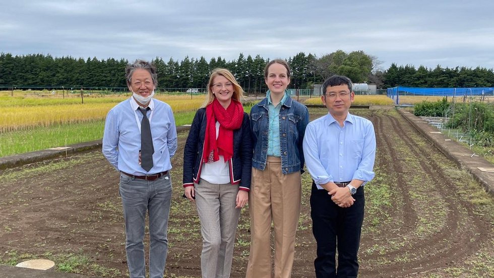 researchers from Poland and Japan against the background of a field