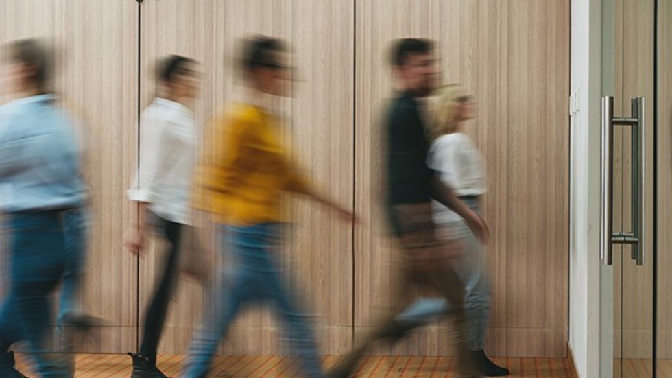 a decorative element: people walking in the office