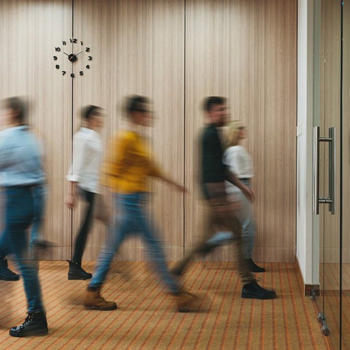 a decorative element: people walking in the office