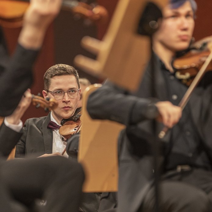 A close-up of a violinist