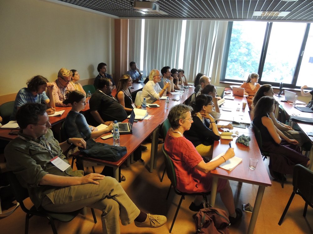 The conference participants in a lecture hall during a reading 