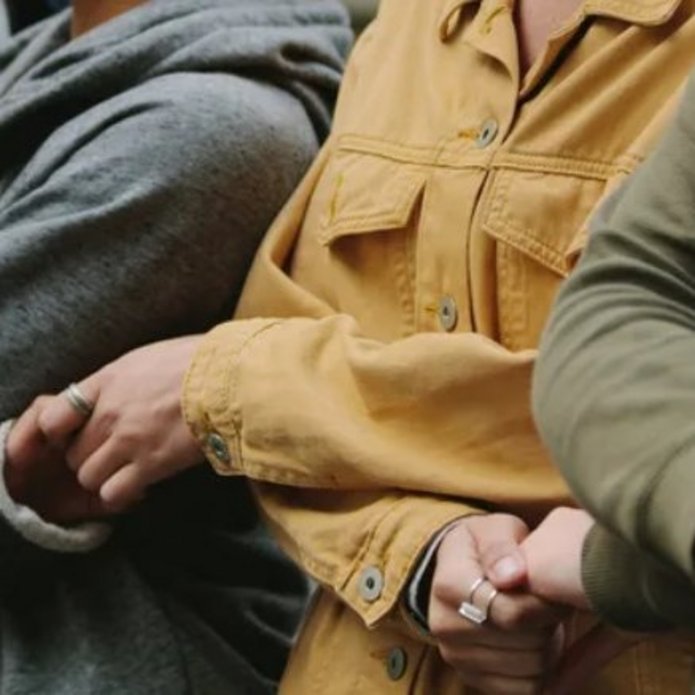 Silhouettes of people holding hands