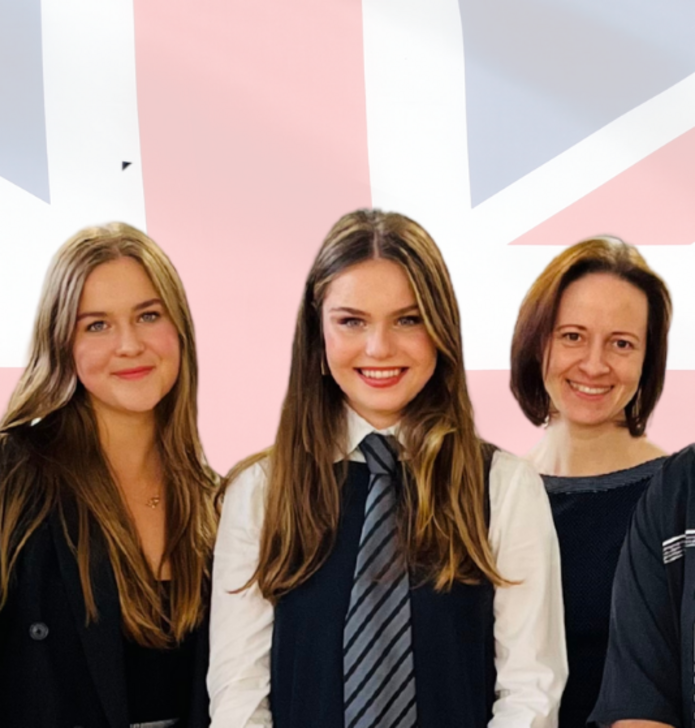 3 women standing against the background of British flag. 