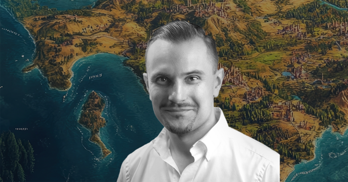 A portrait photo of Dr Krzysztof Maj on a coloured background